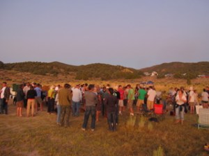 the crowd gathers at dusk